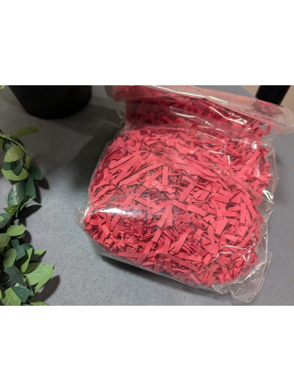 Artificial Flower Arrangement with Decorative Greenery and Shredded Paper Filler